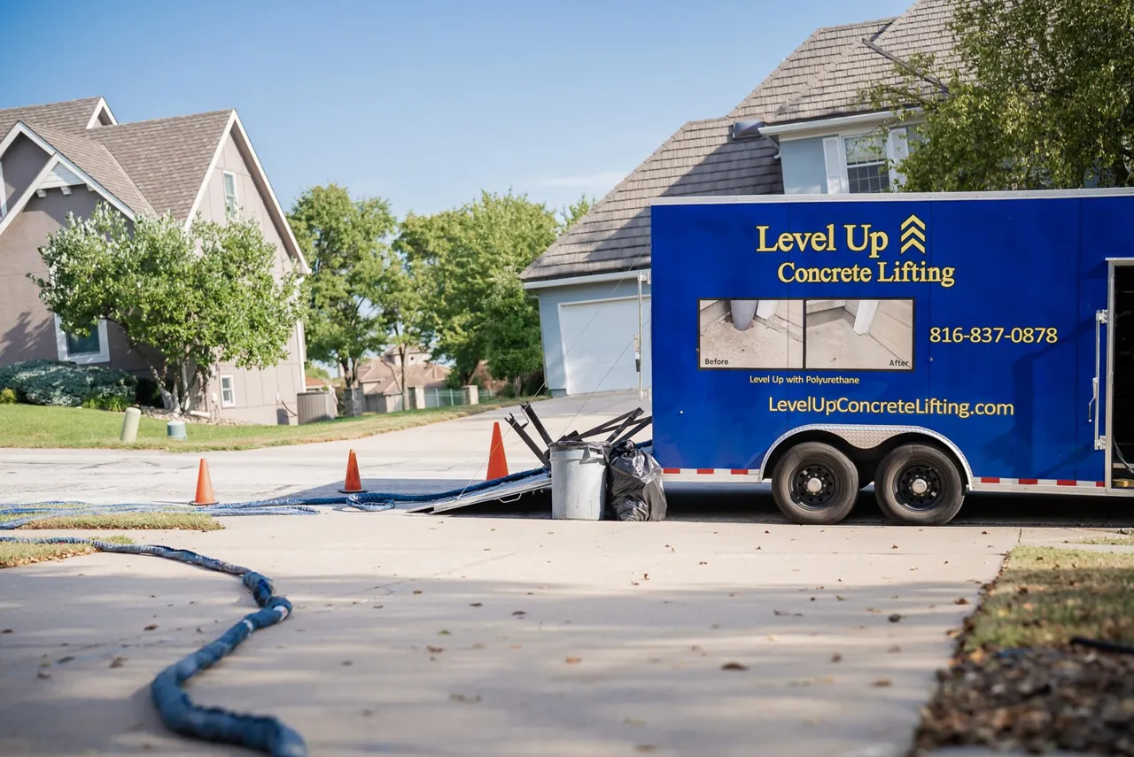 Level Up trailer and lifting hoses on a residential driveway