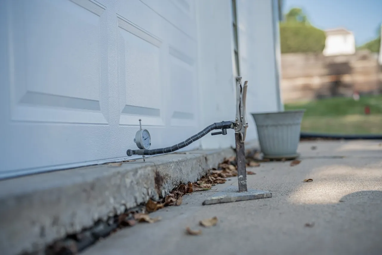 Polyurethane injection equipment beside a garage threshold